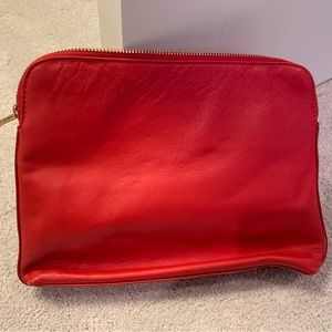 India hicks, small bag, you might put inside a large purse for make up and such.